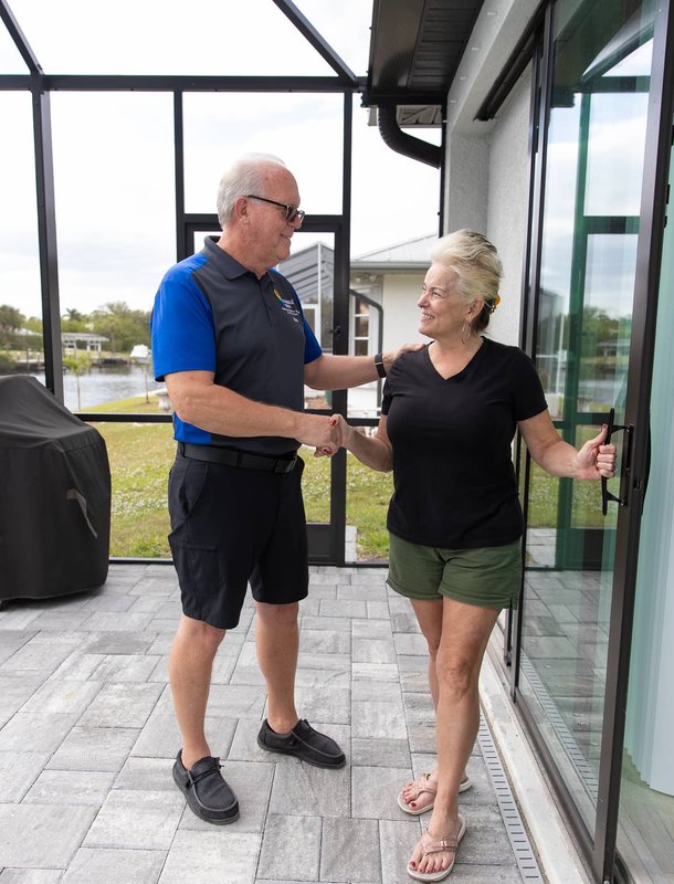 owner shaking clients hand